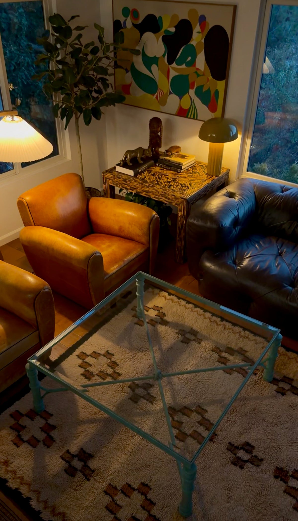 Verdigris and glass coffee table photographed from above showing the base through the glass