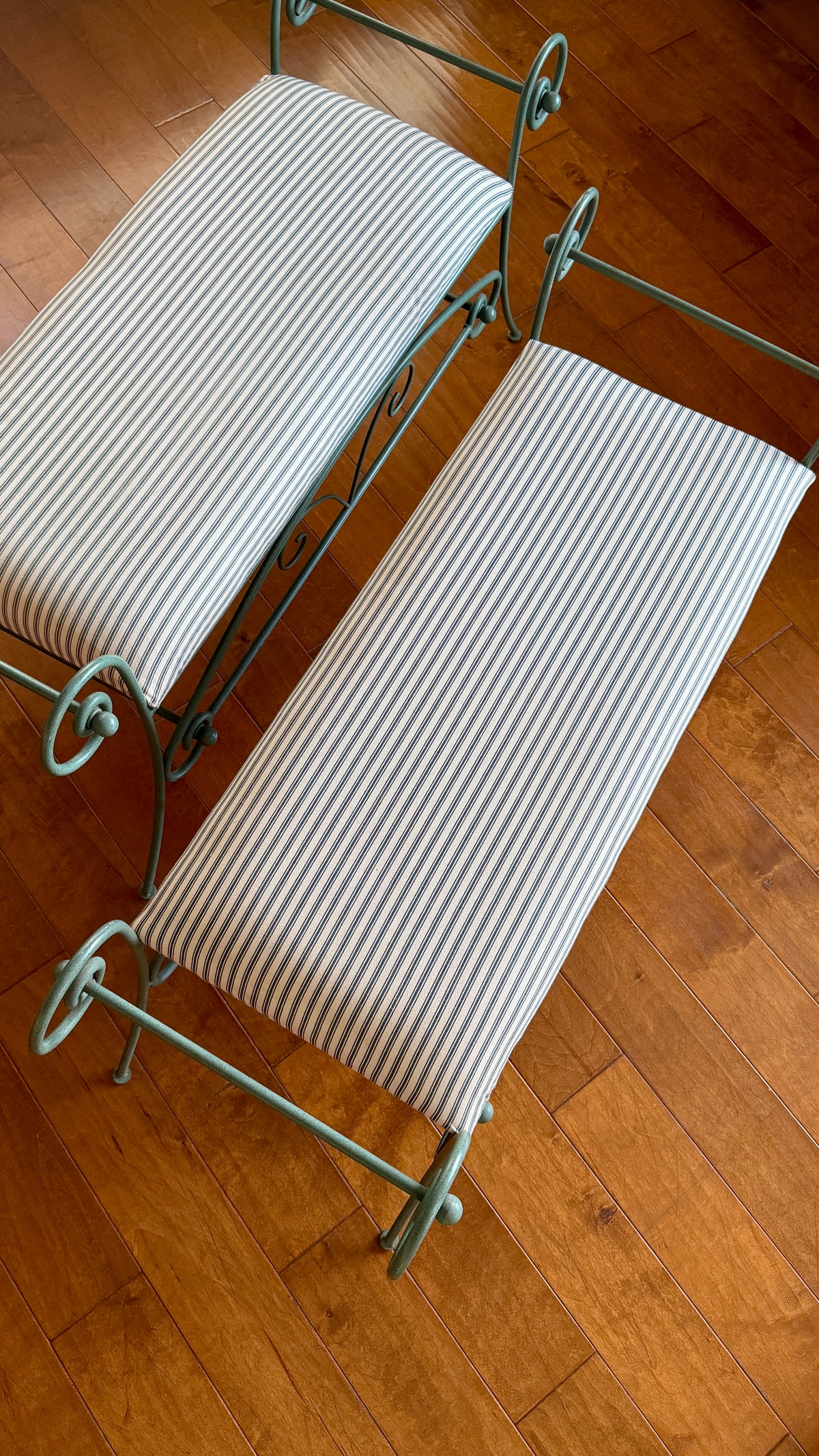 Green iron bench measured against a tape showing the seat height