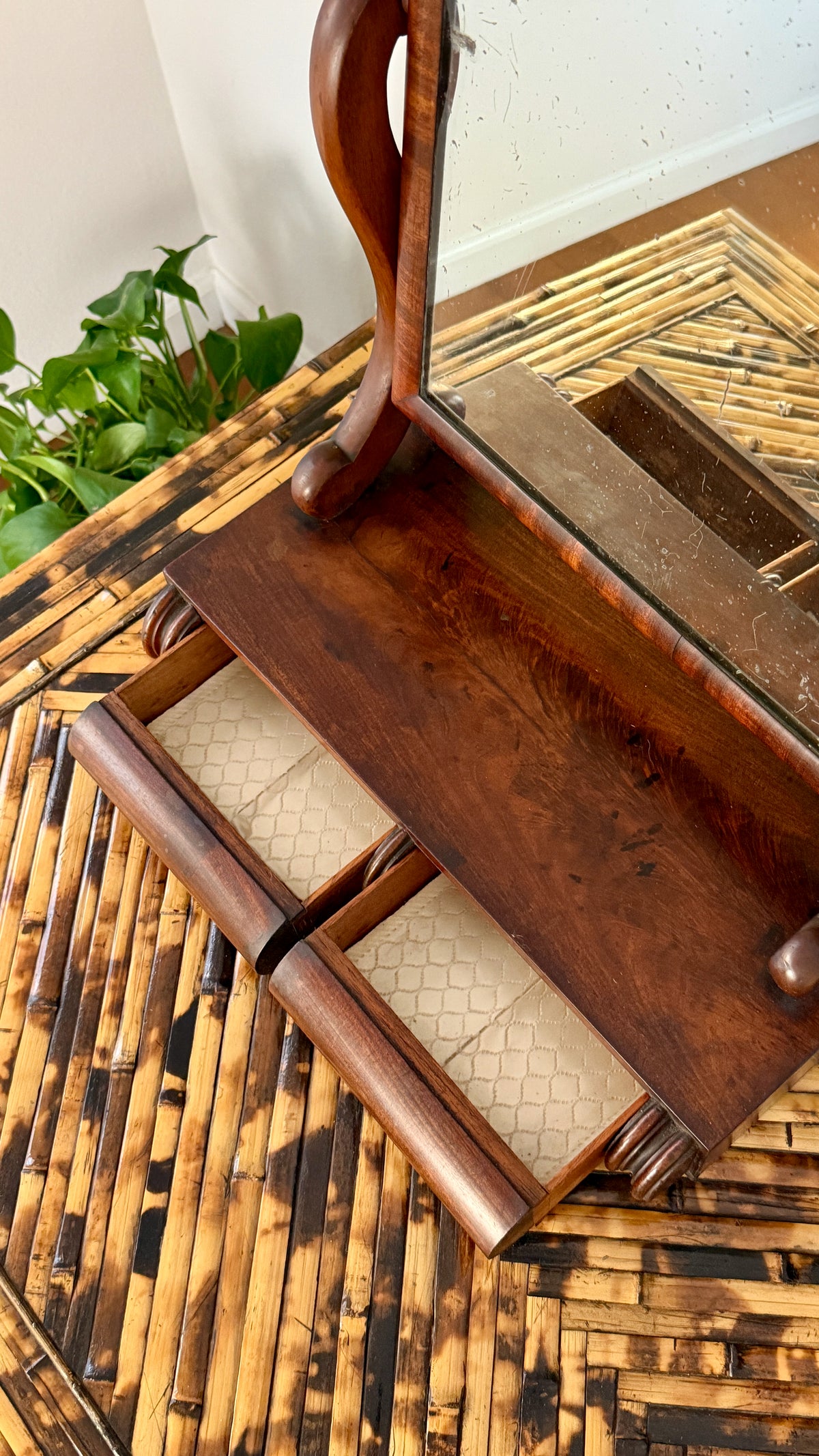 Detail of the flame figuring in the solid mahogany base of the antique dressing mirror
