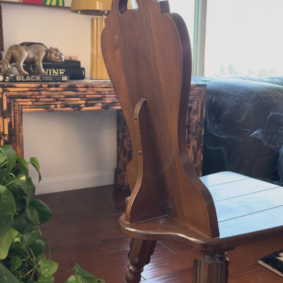 Video of a Tyrolean Brettstuhl chair showing the pierced grip cut into the shaped back