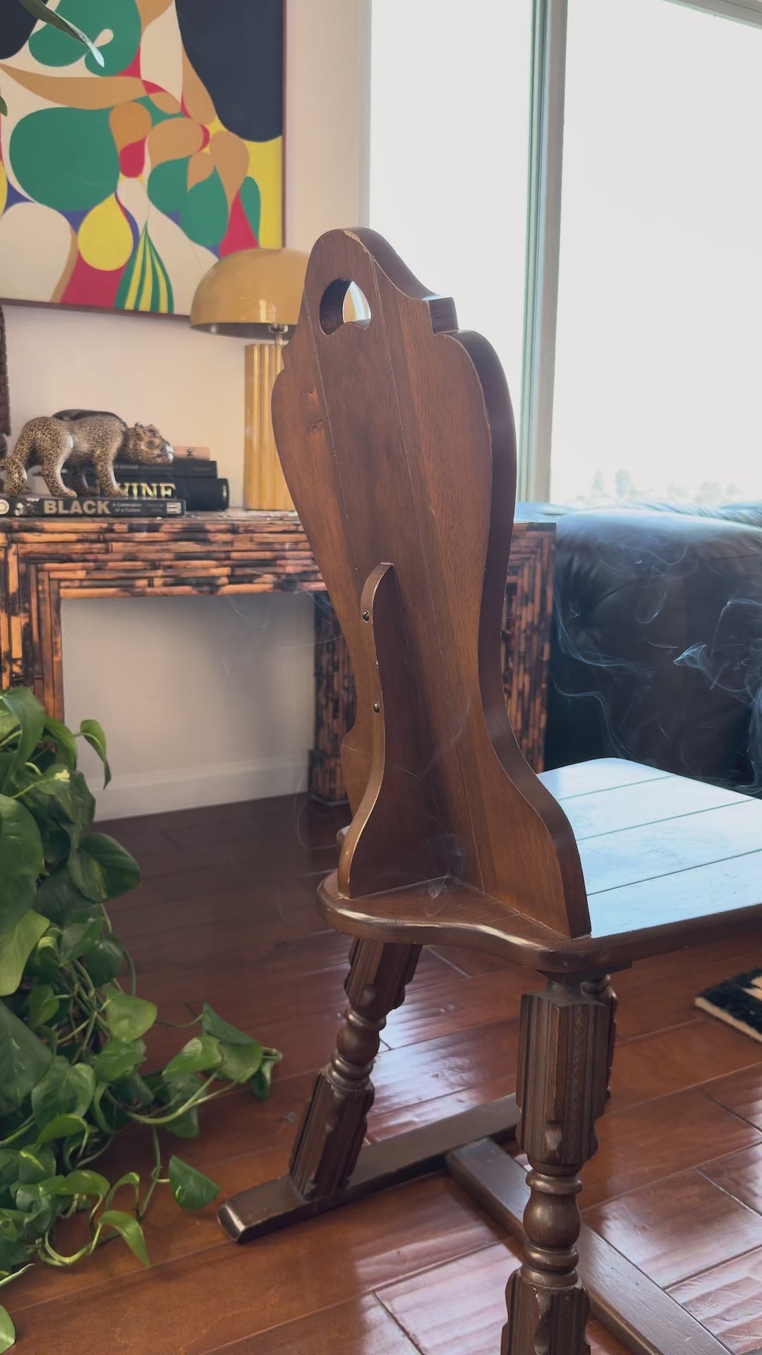 Video of a Tyrolean Brettstuhl chair showing the pierced grip cut into the shaped back