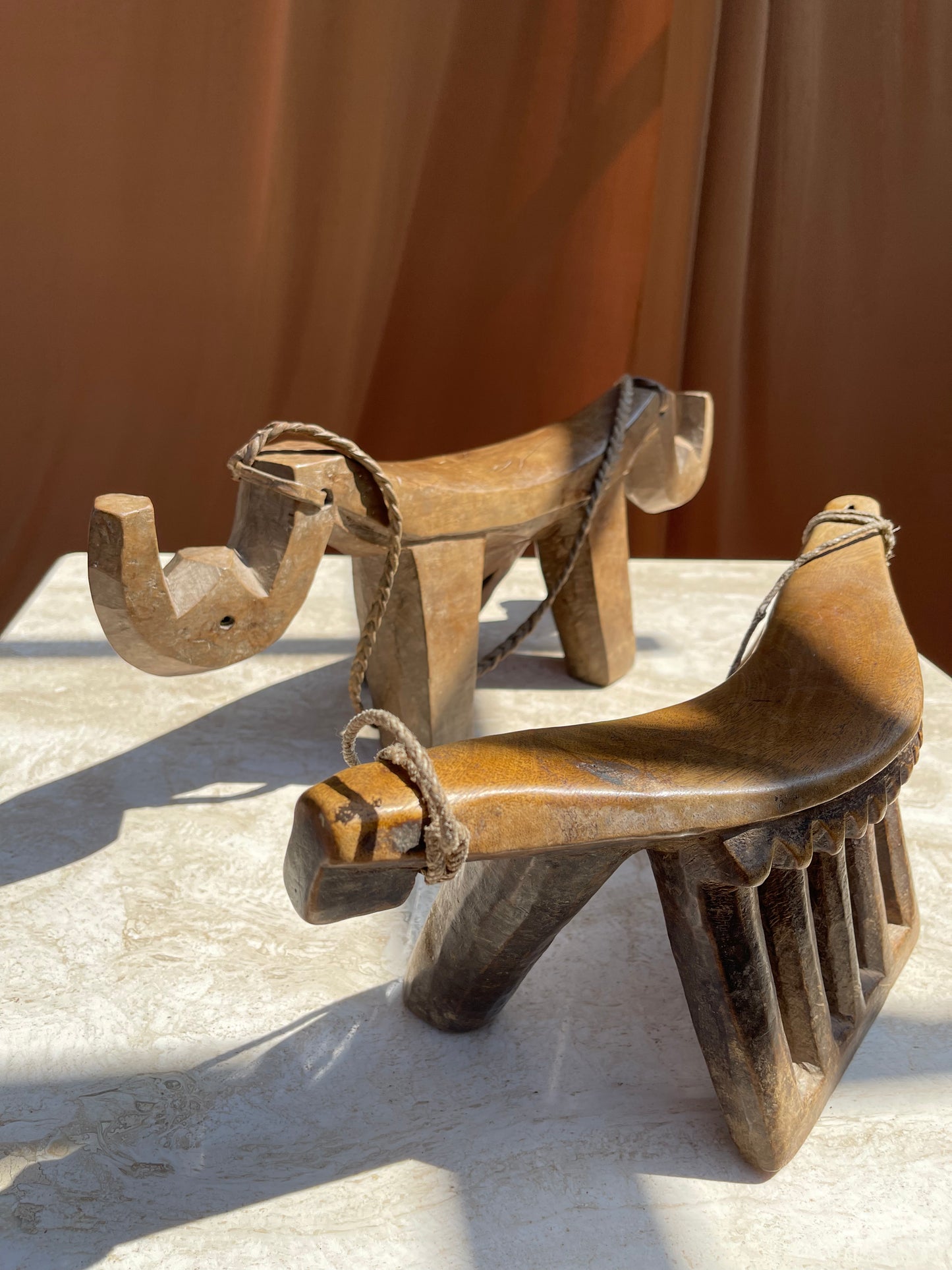 Close view of the deep patina on the carved wood of the Lobi stool