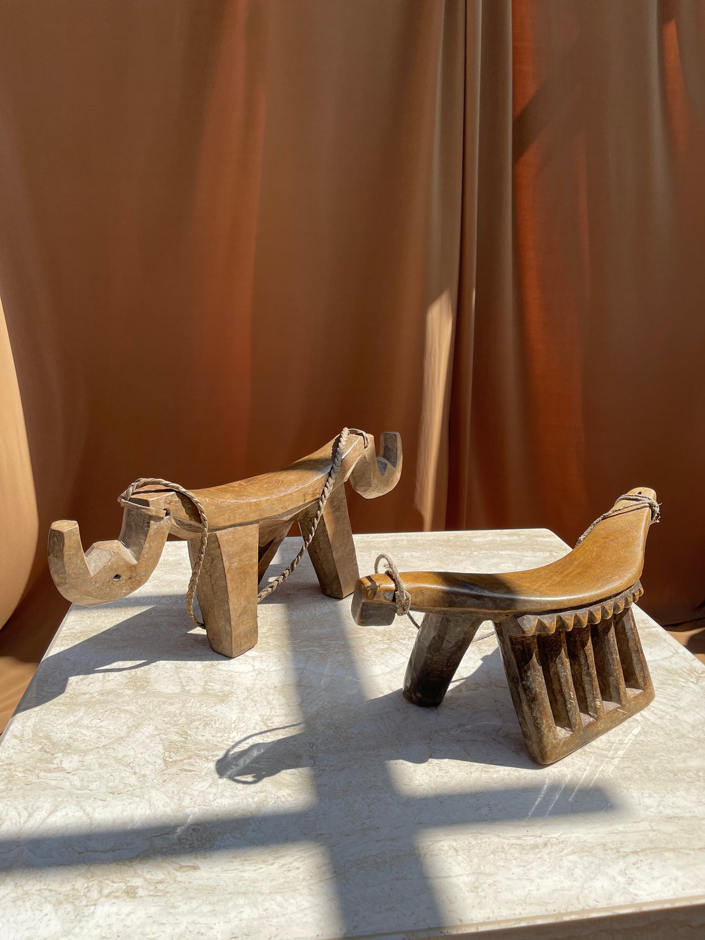 Antique Lobi stool shown in a styled interior setting