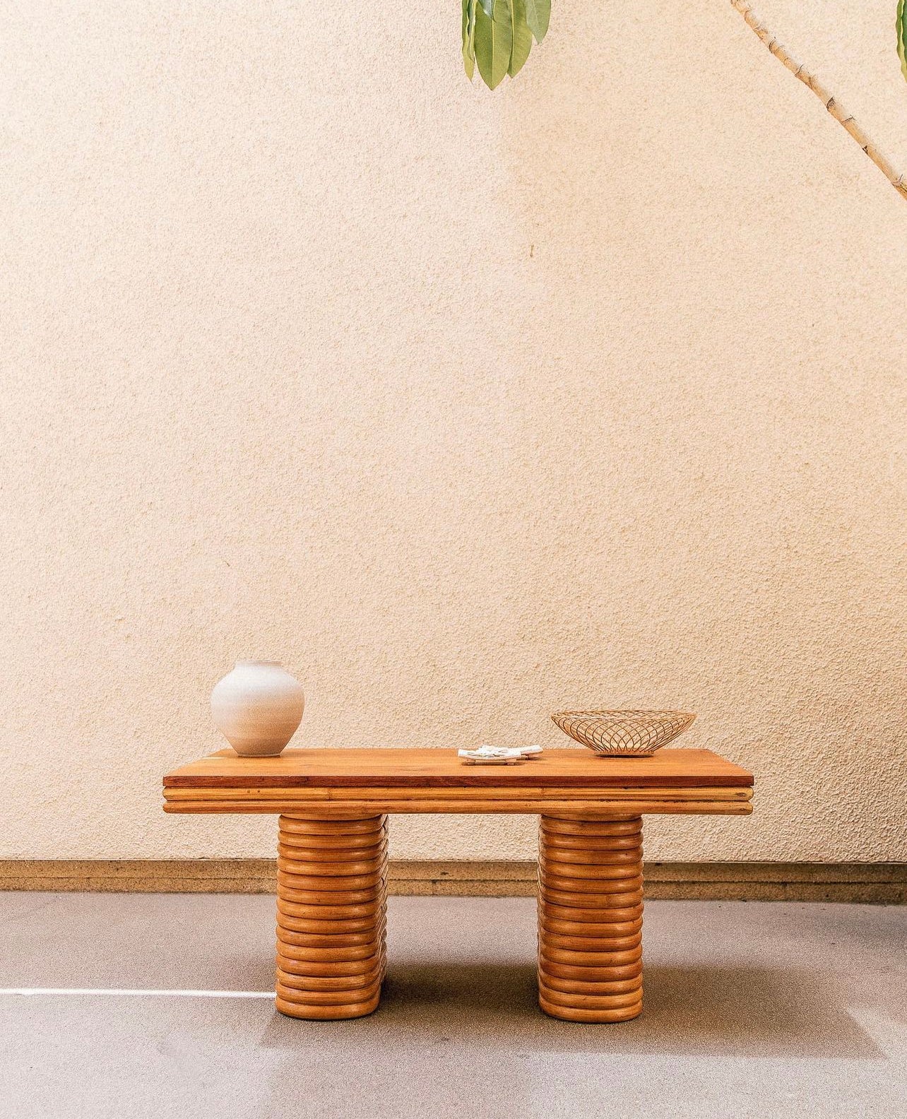 Vintage cane bowl shown in a styled interior setting