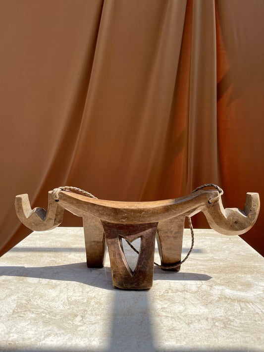 Antique hand-carved Lobi stool from Burkina Faso with braided leather carrying cord