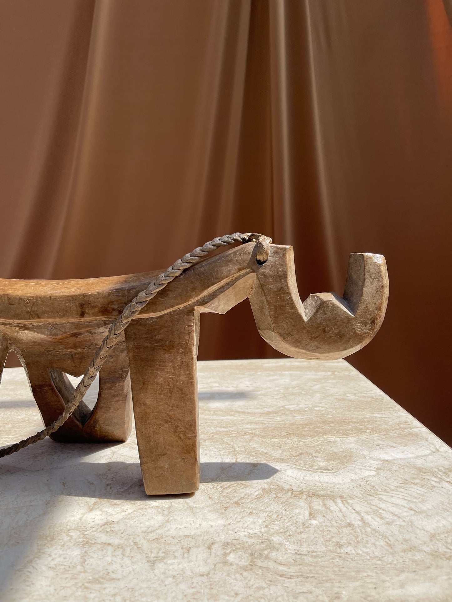 Underside of the antique Lobi stool showing hand-carved surface