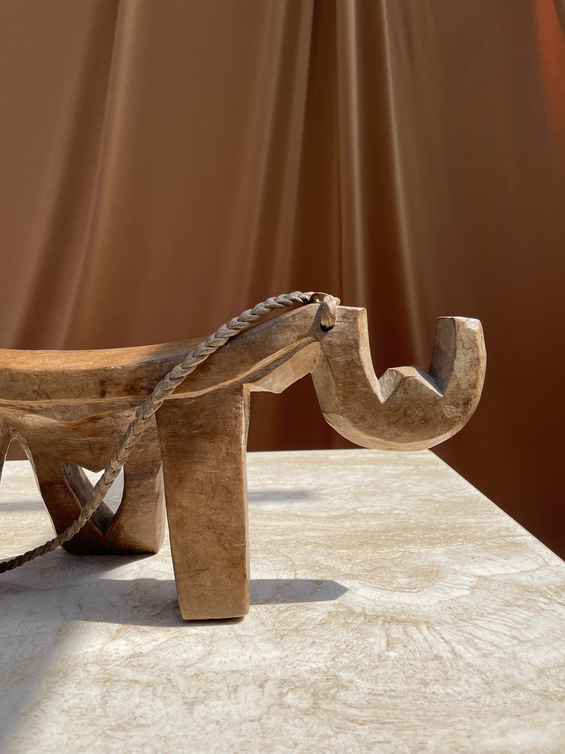 Underside of the antique Lobi stool showing hand-carved surface