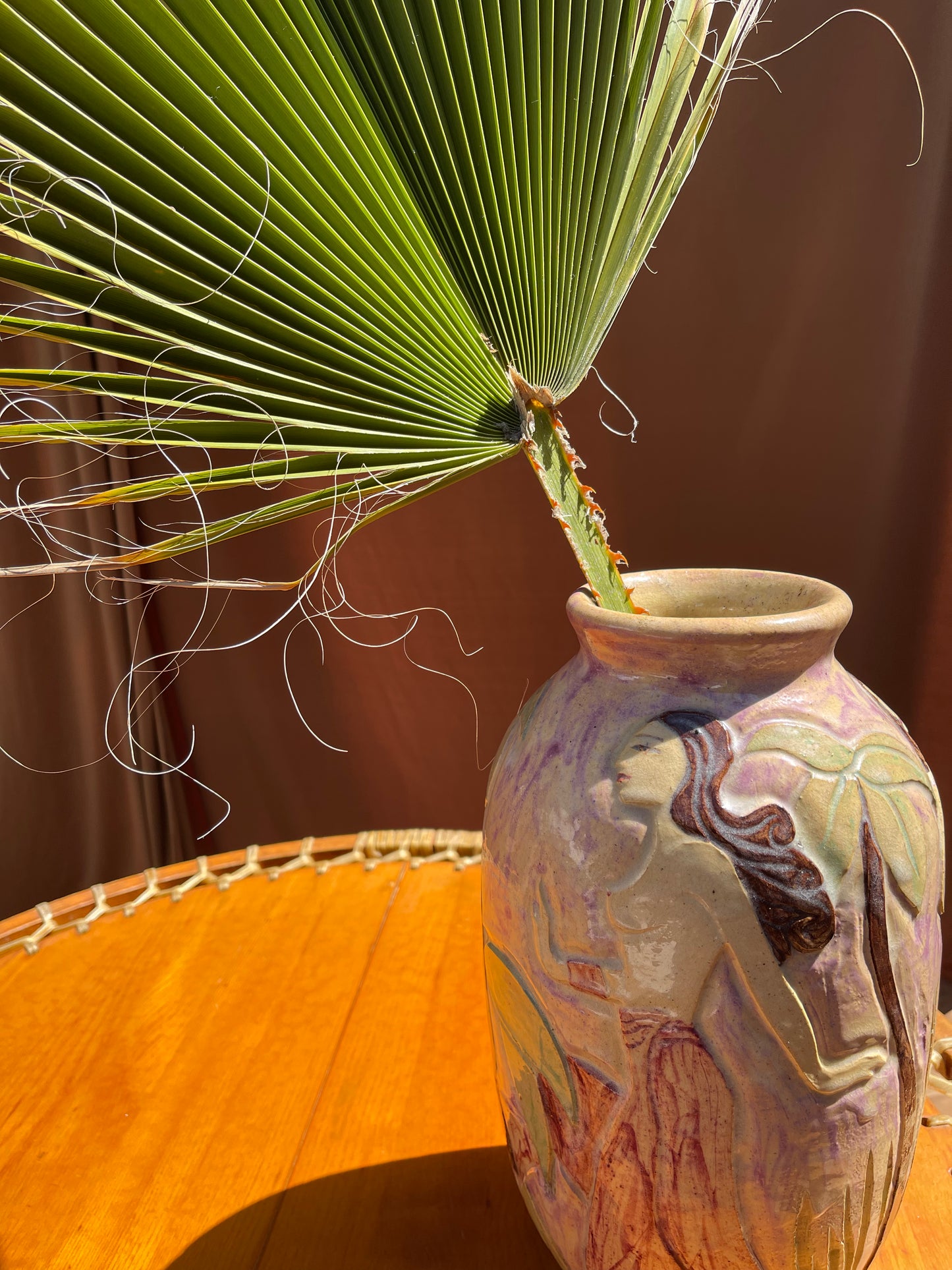 Hand-painted ceramic vase, alternate view showing etched figures around the circumference
