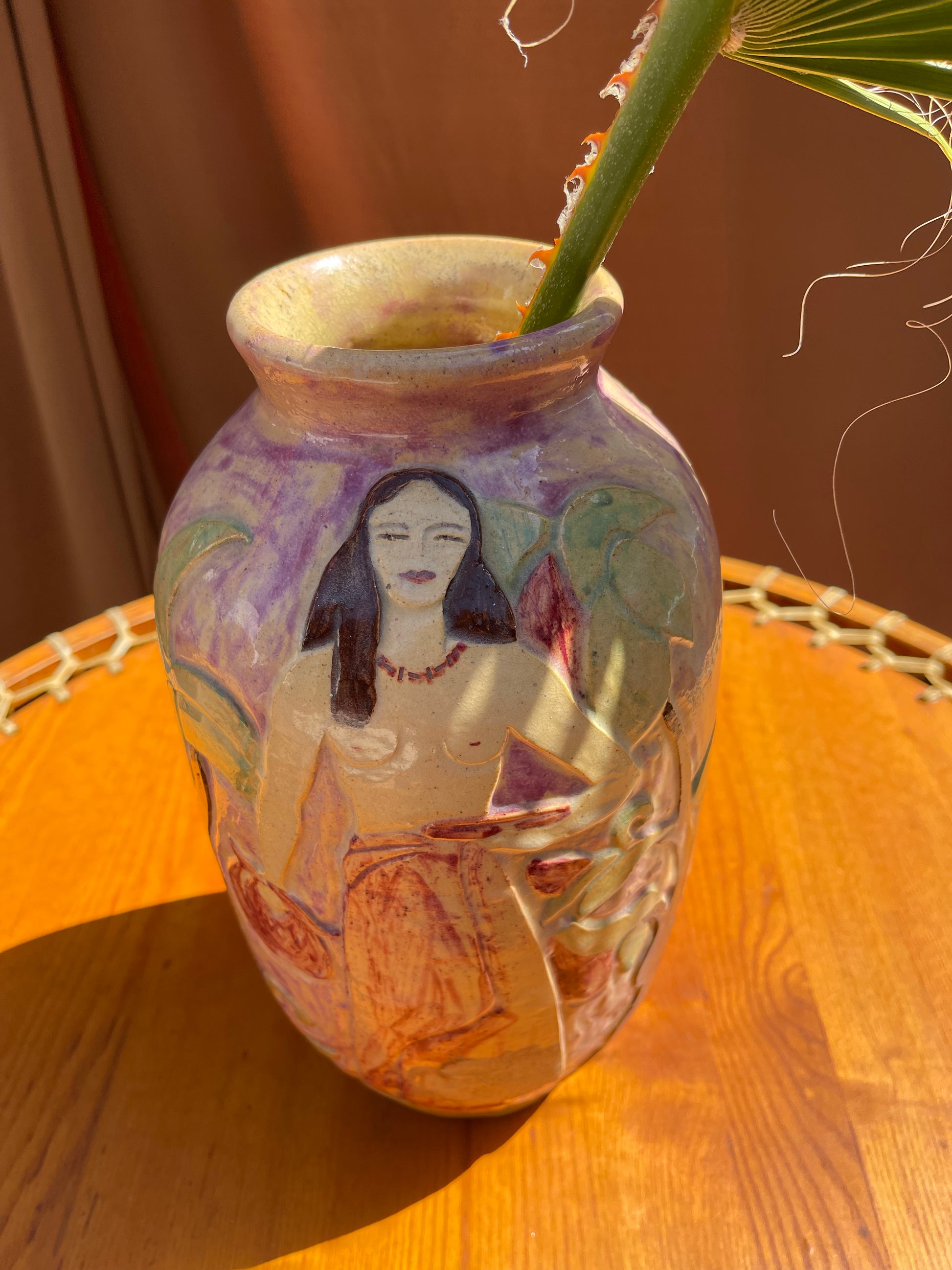 Vintage hand-painted ceramic vase viewed from above